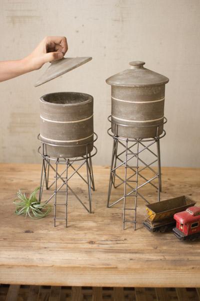 Set Of 2 Grey Wash Clay Water Tower Canisters With Raw Metal Base